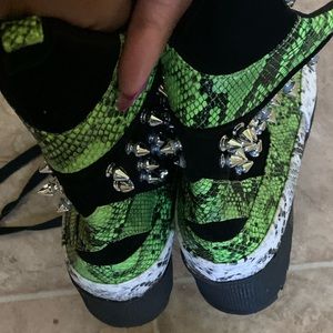 Green, white and black boots with spikes